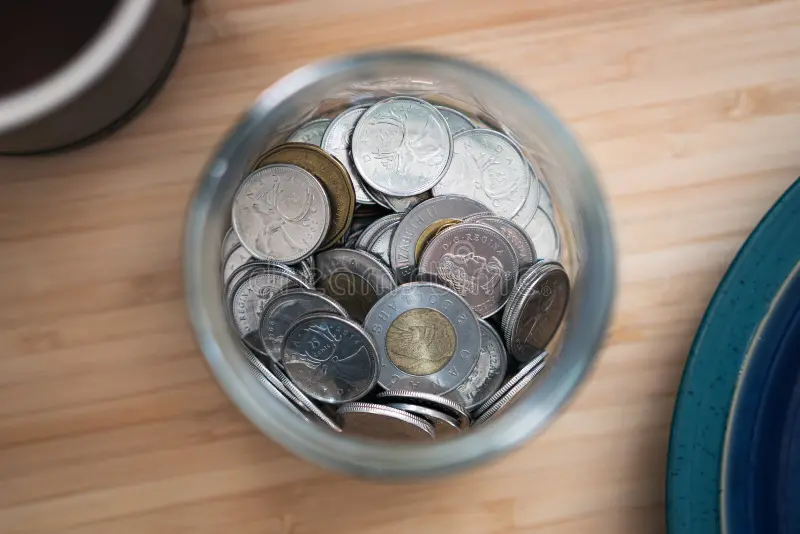 photo canadian toonie loonie quarter money jar desk canadian toonie loonie quarter money jar desk 233142385