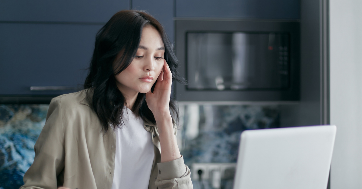 homeowner looking at the laptop worried about the mortgage delinquency rate